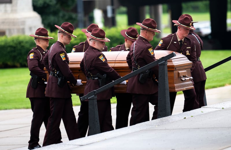 Minnesota State Patrol members carry the casket of Mark Hortman, husband of Rep. Melissa Hortman, before a funeral ceremony at the Basilica of Saint Mary on June 28 in Minneapolis, Minnesota.