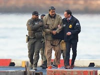 Nicolas Maduro is seen in handcuffs after landing at a Manhattan helipad, escorted by heavily armed Federal agents on January 5, 2026 in New York City.