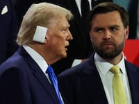 J.D. Vance stands next to Donald Trump at the GOP convention in Milwaukee