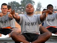 articles/2015/05/23/the-downward-facing-dogs-of-war/150522-adamic-yoga-tease_lcp3xi