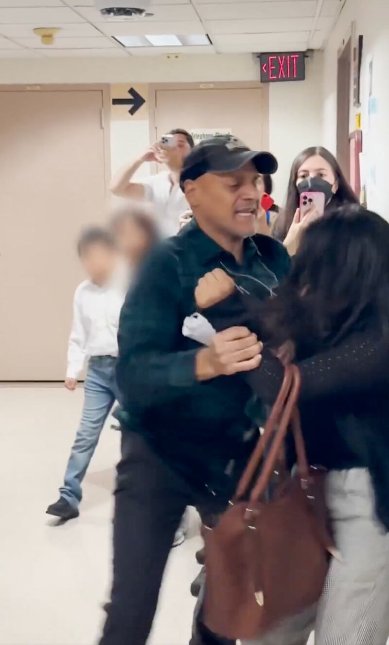 Screengrab from an ICE agent's altercation with a woman outside a New York immigration court on September 25.