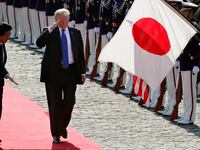 U.S. President Donald Trump reviews an honor guard during a welcome ceremony with Japanese Prime Minister Shinzo Abe at Akasaka State Guest House in Tokyo, Monday, Nov.6, 2017.