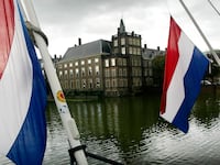 Flags hang at half mast in front of the Dutch Parliament in the Hague the day after the death of Prince Claus, the husband of Queen Beatrix, October 7, 2002.