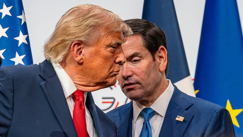 Secretary of State Marco Rubio repeats a Japanese reporter's questions spoken in English to President Donald Trump during his press conference at the 2026 G7 Summit in France on June, 17 2026.