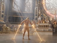 A man stands naked in front of a court.