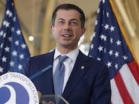 Pete Buttigieg speaks to questions during a news conference in Arlington, Virginia.