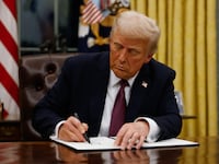 President Donald Trump signs executive orders in the Oval Office of the White House on January 20, 2025 in Washington, DC.