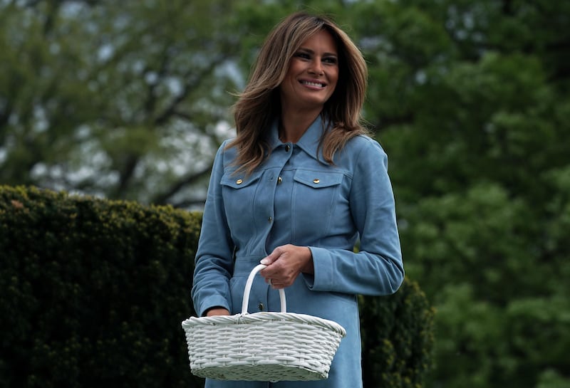 First Lady Melania Trump watches children participating in the 141st Easter Egg Roll on the South Lawn of the White House in 2019.