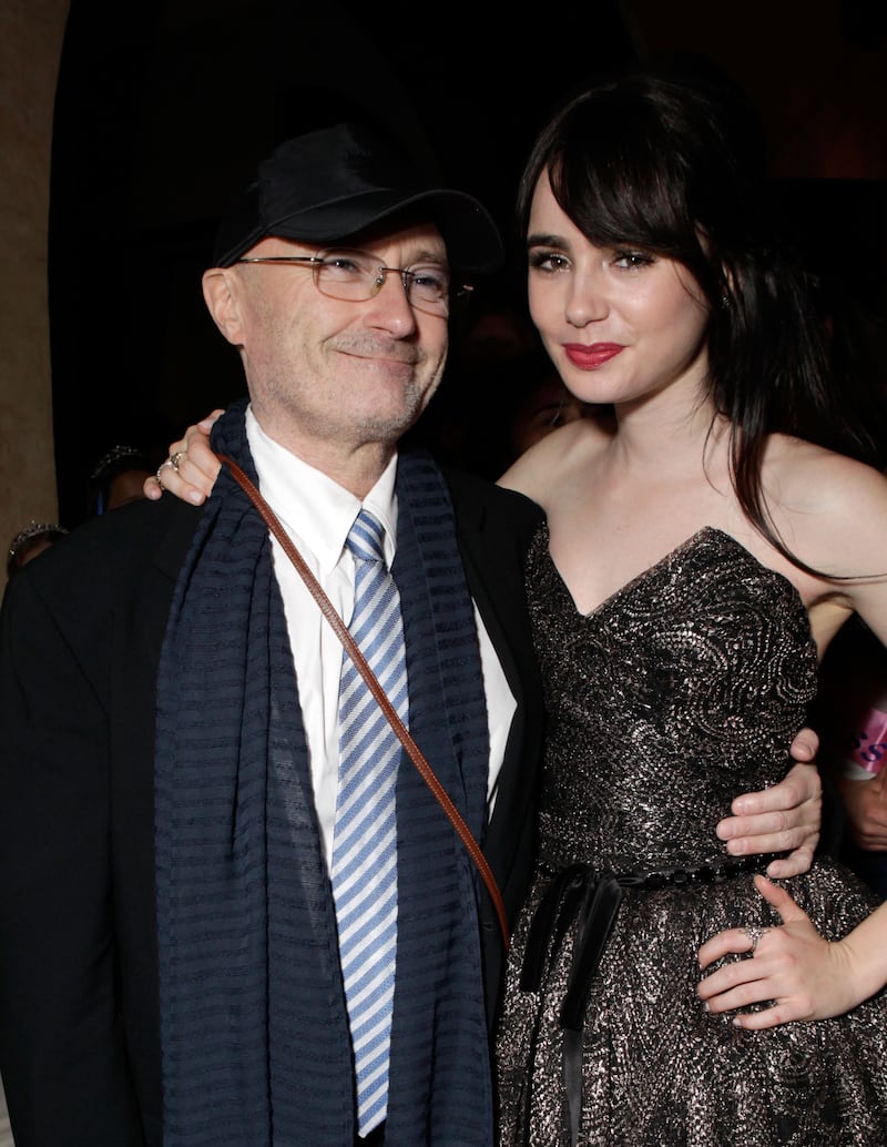 Musician Phil Collins and daughter Lily, then 22, attend the after-party for the premiere of 'Mirror Mirror' in Hollywood, California, on March 17, 2012.