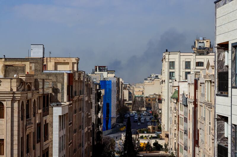 A plume of smoke rises following a reported explosion in Tehran on February 28, 2026. Two loud blasts were heard in Tehran on February 28 morning by AFP journalists, and two plumes of thick smoke were seen over the centre and east of the Iranian capital. Israel's defence ministry announced it had launched a "preemptive strike" on Iran as sirens sounded in Jerusalem and people across the country received phone alerts about an "extremely serious" threat. (Photo by ATTA KENARE / AFP via Getty Images)
