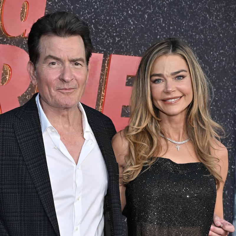 US actor Charlie Sheen and US actress Denise Richards attend the Los Angeles premiere of Netflix's "aka Charlie Sheen" at the Tudum theatre in Hollywood, California, on September 4, 2025. (Photo by LISA O'CONNOR / AFP)