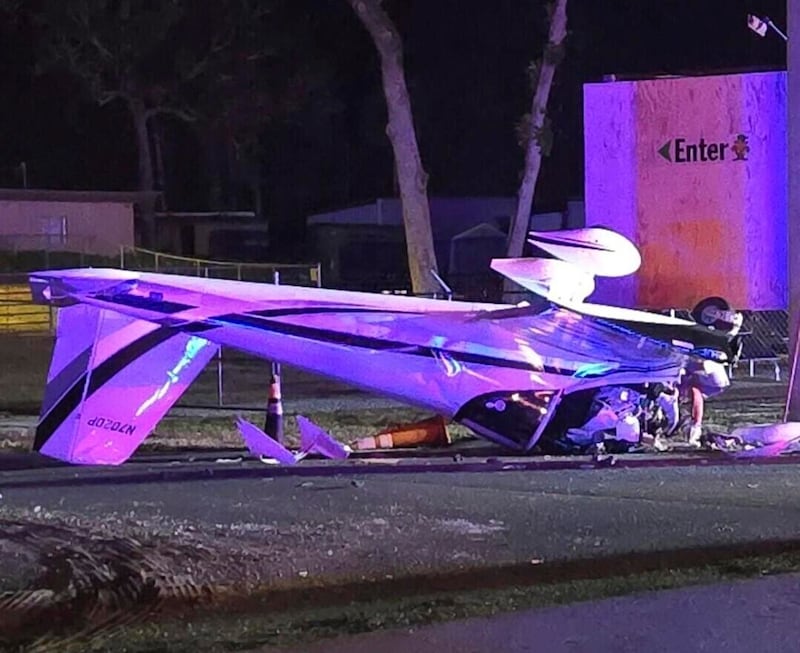 An image released by the Florida Department of Highway Safety and Motor Vehicles shows a small plane upturned after it crashed about 60 miles north of Tampa, Florida.