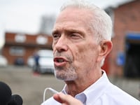 Congressman Bill Johnson speaks with the media as he attends a press conference after inspecting the site of a train derailment of hazardous material in East Palestine, Ohio