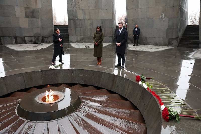YEREVAN, ARMENIA - FEBRUARY 10: Edita G. Gzoyan (L), director of the Armenian Genocide Museum-Institute, U.S. Vice President JD Vance and wife Usha Vance pay tribute at the eternal flame during a visit to the Tsitsernakaberd Armenian Genocide Memorial on February 10, 2026 in Yerevan, Armenia. In the first visit to Armenia of a sitting U.S. vice president, Vance is meeting Armenian Prime Minister Nikol Pashinyan, who signed a deal intended to reopen key transportation routes with Azerbaijan. (Photo by Kevin Lamarque-Pool/Getty Images)
