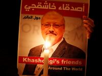 A demonstrator holds a poster with a picture of Saudi journalist Jamal Khashoggi outside the Saudi Arabia consulate in Istanbul, Turkey