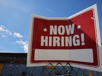 A Now Hiring sign in Sommerville, Massachusetts.