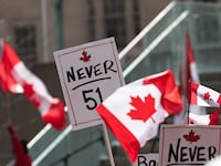 TORONTO, CANADA - MARCH 22 : People carrying Canadian flags and banners against '51st state' attend 'Elbows up, Canada!' rally, non-partisan, family-friendly gathering celebrating Canada's strength, unity, and resilience at Nathan Phillips Square in Toronto, Canada on March 22, 2025. (Photo by Mert Alper Dervis/Anadolu via Getty Images)