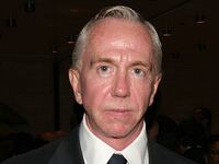 Brent Sikkema stares forward while posing for a photo at an event.