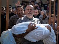 Palestinians mourn and carry the bodies of their loved ones who lost their lives after an attack of the Israeli army in Khan Younis, Gaza.