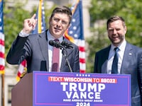 Rep. Bryan Steil addresses the audience at a Trump campaign rally while then-Sen. J.D. Vance looks on at a campaign rally on August 20, 2024 in Kenosha, Wisconsin.