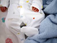 A generic photo of a newborn baby.