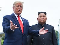 President Donald Trump speaks as he stands with North Korea's leader Kim Jong Un south of the Military Demarcation Line that divides North and South Korea, on June 30, 2019.