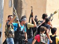 articles/2012/07/18/inside-the-syrian-bomb-plot/syria-rebels-paul_tusrec