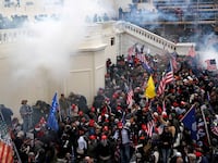 2021-02-23T000000Z_467321865_RC2LYL93XCR4_RTRMADP_3_USA-TRUMP-CAPITOL-COP_bibzpw