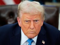 Donald Trump talks to reporters after signing an executive order, "Unleashing prosperity through deregulation," in the Oval Office on January 31, 2025 in Washington, DC.