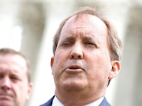 Texas Attorney General Ken Paxton (R) and Missouri Attorney General Eric Schmitt talk to reporters after the U.S. Supreme Court heard arguments in their case about Title 42 on April 26, 2022 in Washington, DC.