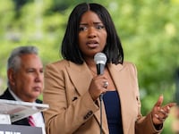 Congresswoman Jasmine Crockett speaks alongside other elected officials gather for a rally ahead of a public hearing on the proposed congressional redistricting on Saturday, July 26, 2025 in Houston.