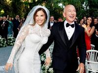 Amazon Founder Jeff Bezos and Media Personality Lauren Sanchez Bezos react on the day of their wedding in Venice, Italy, June 27, 2025 in this picture obtained from social media.
