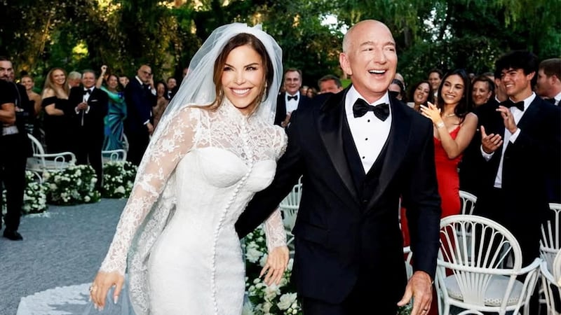 Amazon Founder Jeff Bezos and Media Personality Lauren Sanchez Bezos react on the day of their wedding in Venice, Italy, June 27, 2025 in this picture obtained from social media.