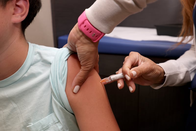 CORAL GABLES, FLORIDA - SEPTEMBER 15: A child receives a standard immunization at Doctor Gary M. Kramer, MD, PA's Pediatric office on September 15, 2025, in Coral Gables, Florida. The Florida Department of Health recently released information on the development of rulemaking to revise immunization and document requirements for school entry.