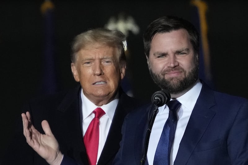 President Donald Trump JD Vance greet supporters during the rally at the Dayton International Airport on November 7, 2022 in Vandalia, Ohio.