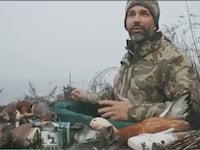Donald Trump Jr. surrounded by dead waterfowl during a hunting trip in the Venice lagoon in December.
