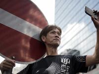 articles/2014/10/01/a-double-agent-app-targets-hong-kong-s-protesters/140930-siegel-hk-tease_sfwtns