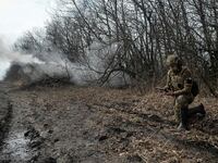 Ukrainian servicemen fire towards Russian troops near the front line city of Bakhmut