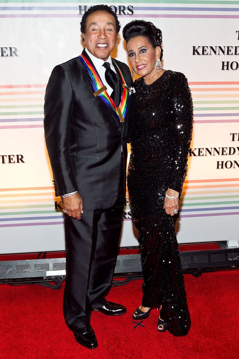 WASHINGTON, DC - DECEMBER 04: Singer Smokey Robinson and his wife Frances Robinson arrive at the 34th Kennedy Center Honors at the Kennedy Center Hall of States on December 4, 2011 in Washington, DC. (Photo by Paul Morigi/WireImage)