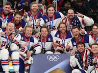 Gold medalists, Team United States, pose for a team photo during the medal ceremony following the Men's Gold Medal match between Canada and the United States.