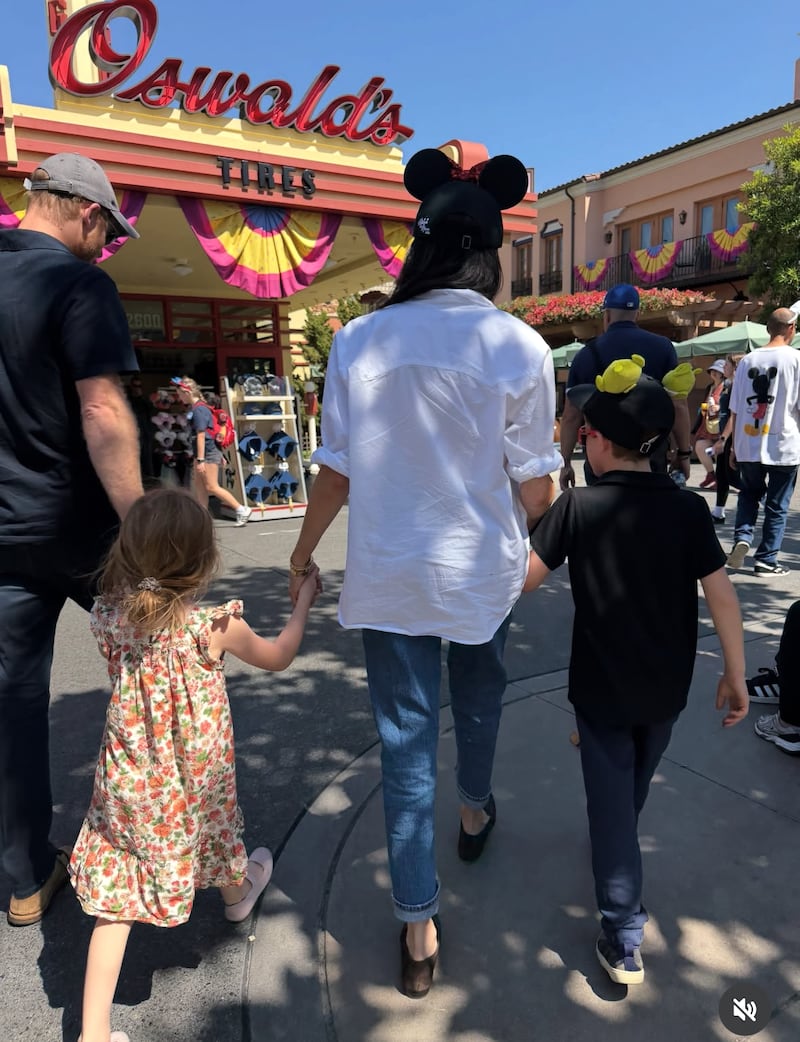 Prince Harry, Princess Lillibet, Meghan Markle, and Prince Archie in Disneyland in California.