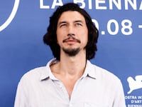 Adam Driver poses for a photo at the Venice Film Festival