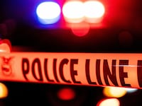 Police tape blocks off the crime scene