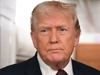 US President Donald Trump speaks to the press aboard Air Force One on January 11, 2026. Trump said Sunday his administration was working well with Venezuela's interim leader Delcy Rodriguez and that he would be open to meeting with her. (Photo by ANDREW CABALLERO-REYNOLDS / AFP via Getty Images)