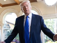 US President Donald Trump speaks to the press as he arrives to attend the wedding of Dan Scavino, White House Deputy Chief of Staff, and Erin Elmore, the Department of State Director of Art in Embassies, at Mar-a-Lago in Palm Beach, Florida, February 1, 2026. (Photo by SAUL LOEB / AFP via Getty Images)