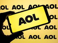 The AOL logo appears on a smartphone screen.