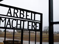 A view of the gate reading “work sets you free” at the former Nazi concentration camp Sachsenhausen in Oranienburg, Germany, Jan. 26, 2022.