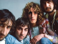A photo including members from The Who