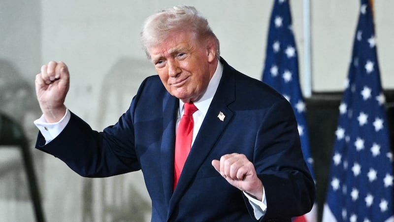 Donald Trump dances on stage next to Melania