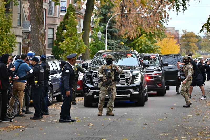 ICE agents conduct operations in Chicago's Little Village neighborhood last month. The Supreme Court has blocked President Trump from federalizing National Guard troops to support them.